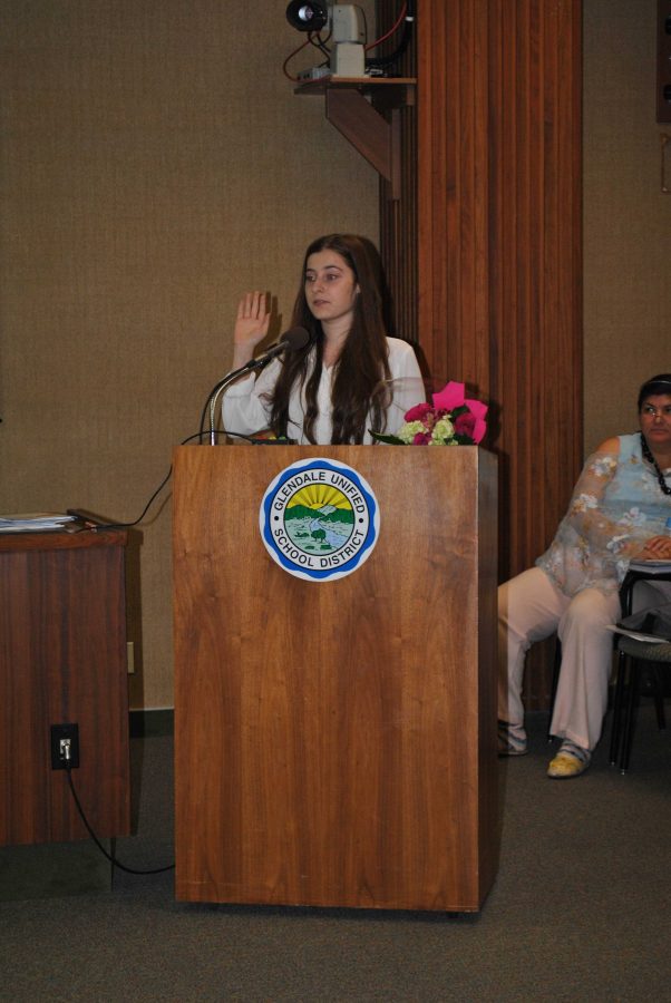 Senior Mary Agajanian being sworn in during Tuesday's Board of Education meeting as the 2014-2015 Student Board Member.