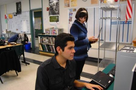 Seniors David Olvera-Sanchez (seated) and Ani Mosinyan (standing) make plans for a future issue of the Chronicle.