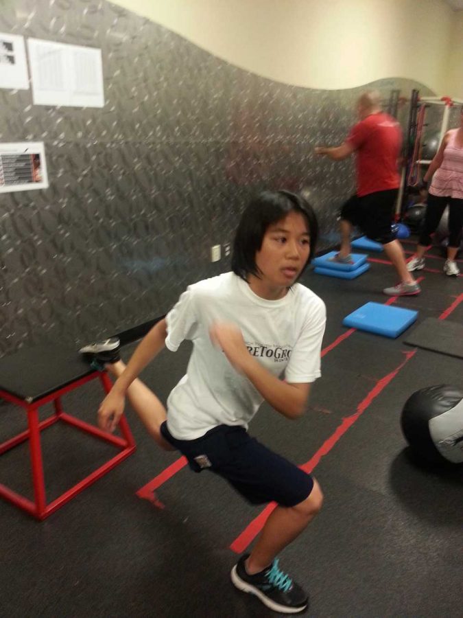 Eunice Sedano trains at a gym and receives help from her mentor.