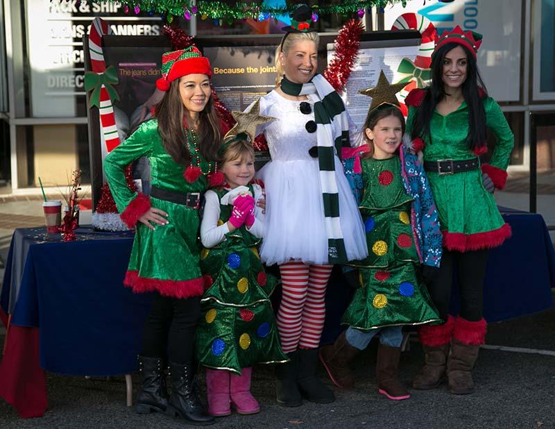 Carolers and little helpers pose for a photo. Jingle Bell Run 5k took place in Dec 7, 2013.
