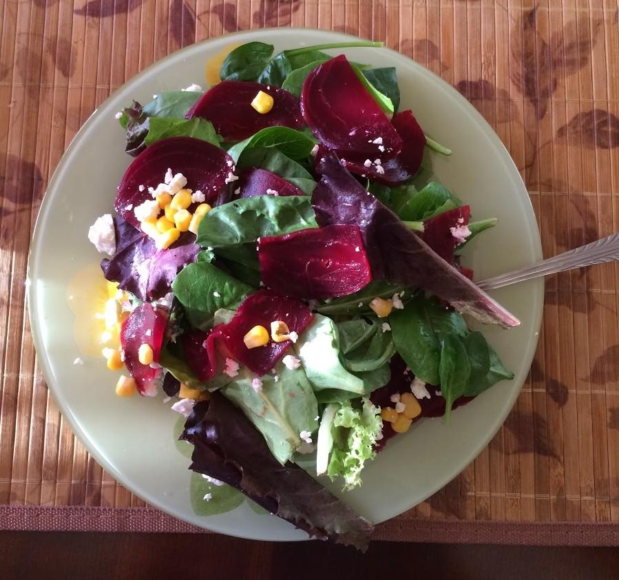 ​This beet salad tastes as delicious as it looks. Green salad with beets, corn and feta cheese. Taking about fifteen minutes to make it, and took me only two minutes for devour it. 
