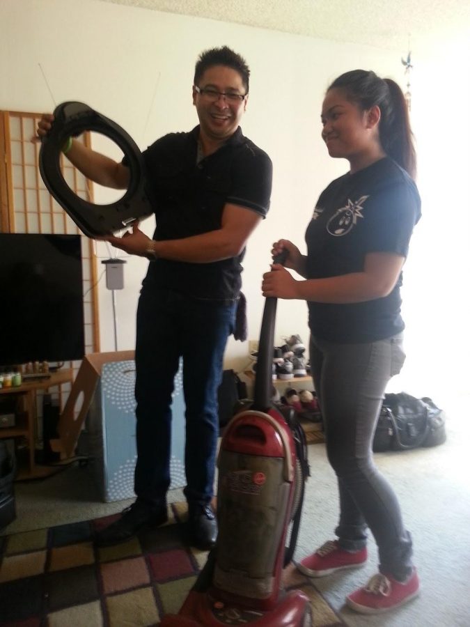 ​My training manager and I comparing the parts of the Rainbow Air Purifier to a regular vacuum.
