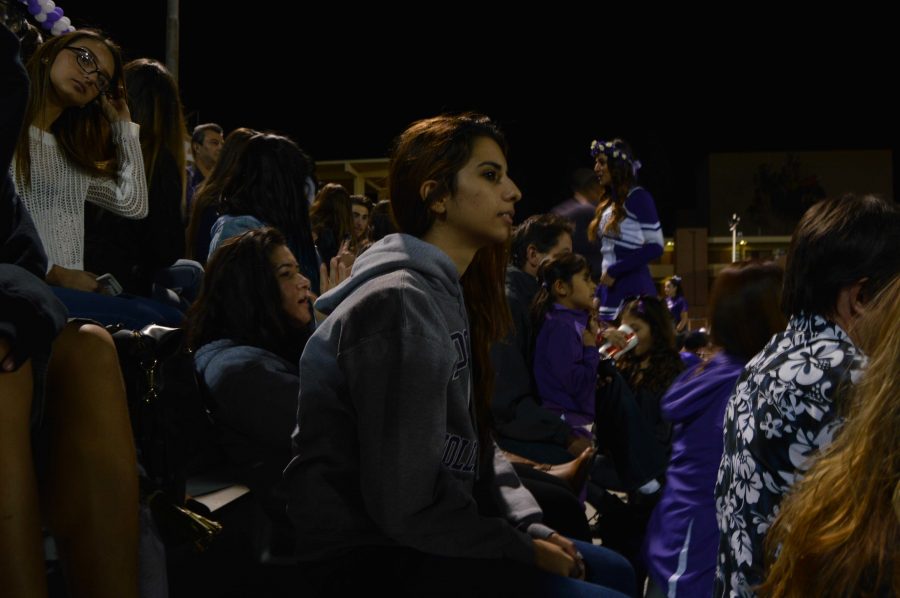 Clark junior Polin Yousefi stares down on the field as Hoovers team suffers a devastating loss. Although her team didnt end up scoring on homecoming night, she wore their schools sweater with pride.
