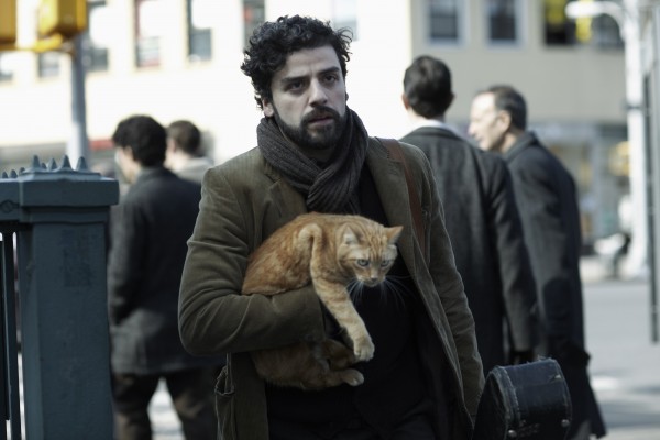 Oscar Isaac with an illusive, symbolic cat in Inside Llewyn Davis.