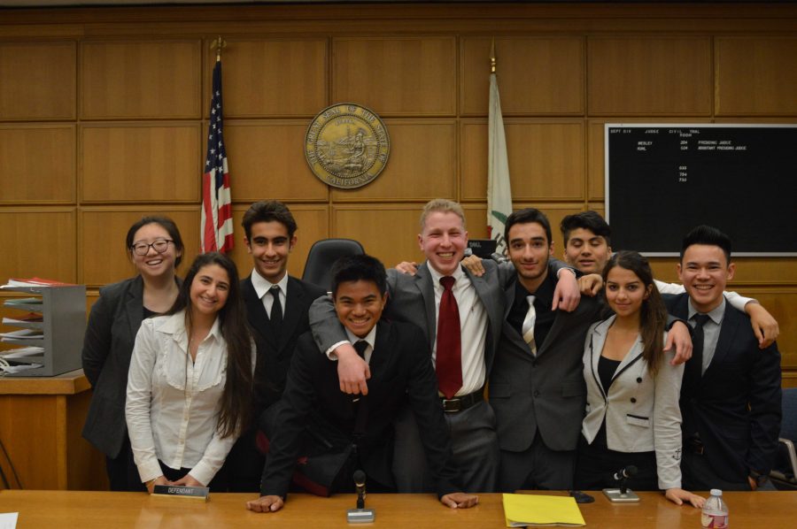 The defense team takes a picture after they receive a verdict of non-guilty!