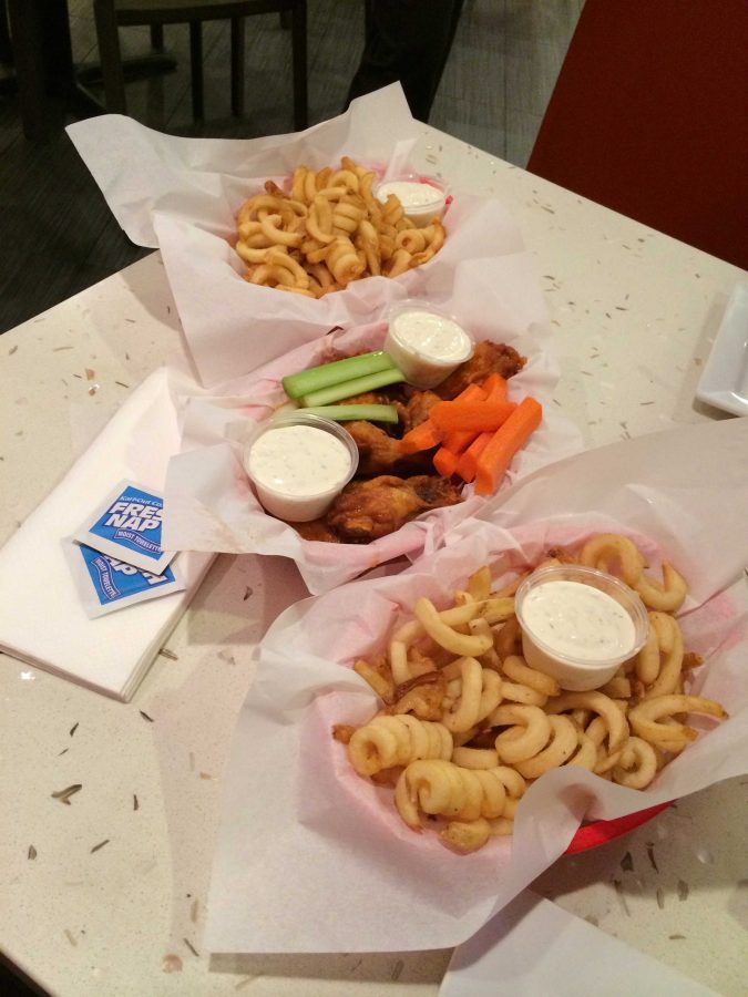 The most popular orders at Hot Wings Cafe. The hot wings are always served with celery and carrot sticks.  

