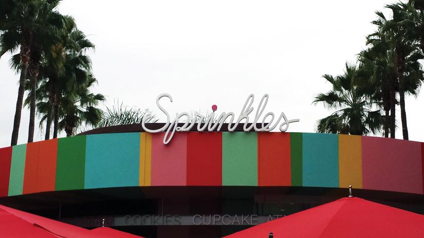 The cursive Sprinkles logo on top of the colorful design on the building draws forth memories of cute tea parties of many childhoods.