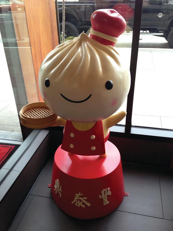 Adorable dumpling statue which represents their house speciality welcomes the customers inside.