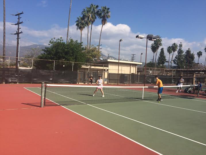 Junior Cynthia Shamerzian playing tennis with the rest of the members of her private tennis group, they are going through warm ups. 
