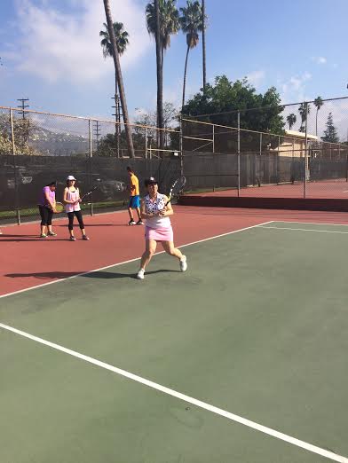 Junior Cynthia Shamerzian playing for her private tennis class.
