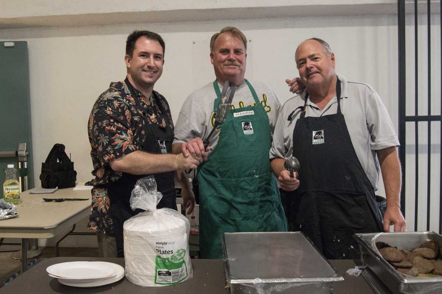 Mr. Landisi (far left) enjoys his first pancake breakfast at Clark making pancakes with Mr. Axelgard (middle) and Mr. Tiffany (far right).