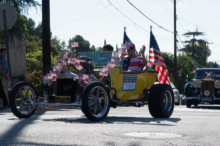 Classic American hot rod decorated with US Flags.