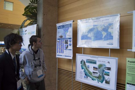 Seniors Devon Taylor and David Ghukasyan look at topographic maps of the sea floor.