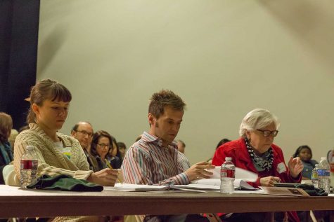 "Judges, from left to right, Alexandra Helgerson, Clayton Hodges and Mary Cobb take notes.