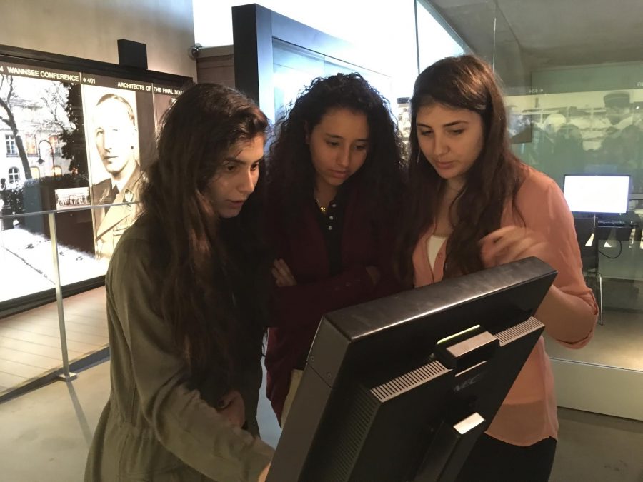 Sophomores+Melanie+Mesropian%2C+Marlene+Saad%2C+and+Anni+Zeynalvand+gather+around+a+monitor+to+look+into+more+information+about+the+concentration+camp+at+Auschwitz.
