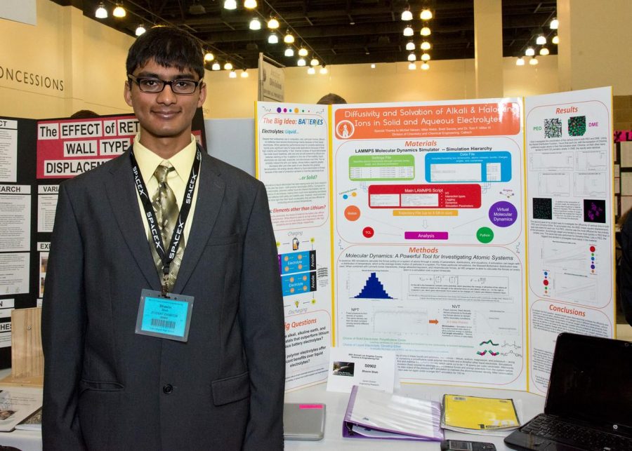 Junior Bhavin Shah with his project that won him second place in the Los Angeles Science Fair. Shah is also advancing on to the state level, taking place in May. 
