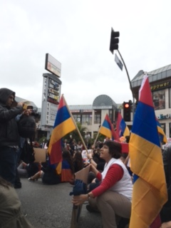 Protesters chant while holding signs made by Armenian Youth Federation members. 