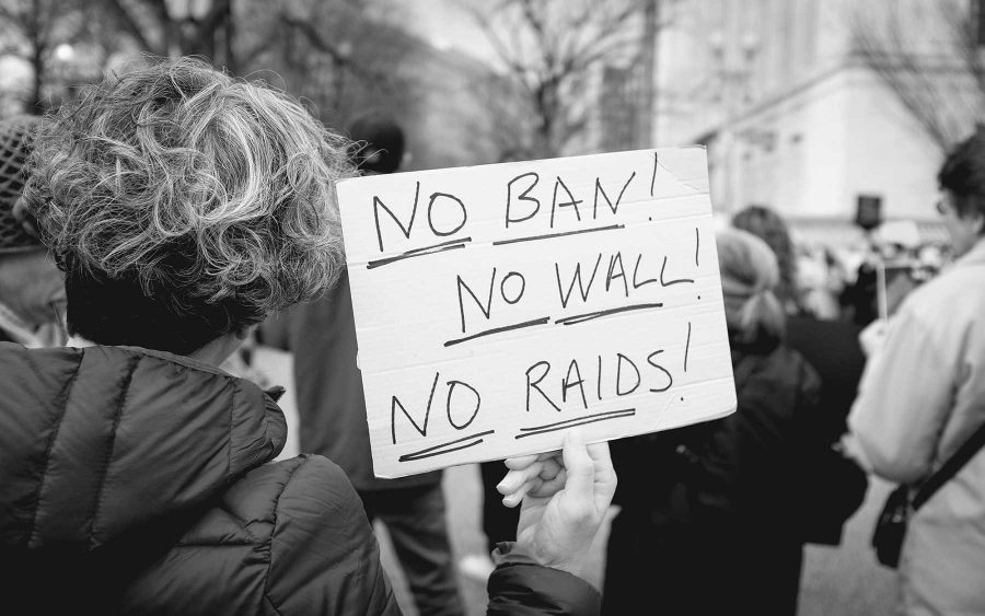 A protester holding a sign against Trumps executive order.