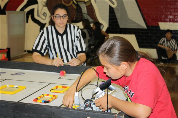 Senior Nanor Asadourian referees a match.