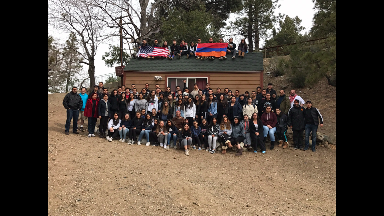 Group photo of students from Clark, Hoover, Creacenta Valley and Glendale High School with camp counselors and school board members.