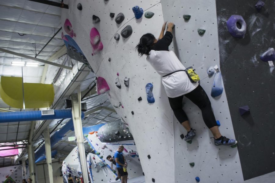 A climber climbs the V1