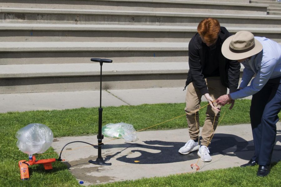 Junior John Sabounjian and Physics teacher, Gerald Gruss prepare to launch the bottle rocket.