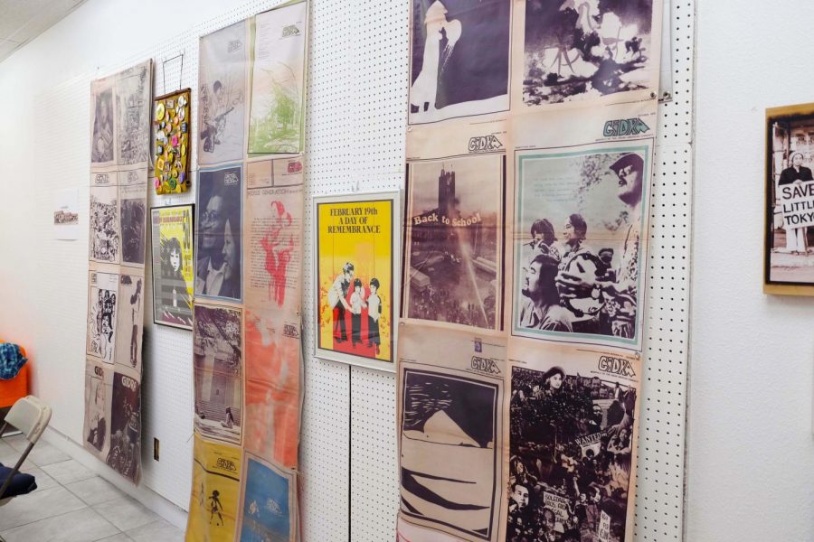 The walls of the room, covered with colorful posters.