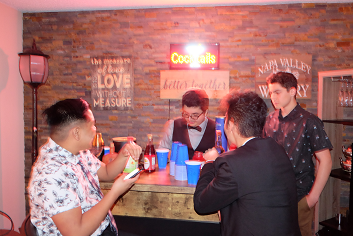 Junior Rafael Aroustamian makes Shirley Temples as juniors Elliot Lubrin, Cole Barrios, and Max Kovach watch and enjoy mock formal.