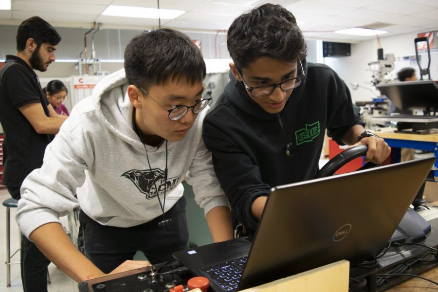 Clark’s robotics team members, seniors Tony Choi and Ismael Hasan, working tirelessly to prepare and win the competition. 