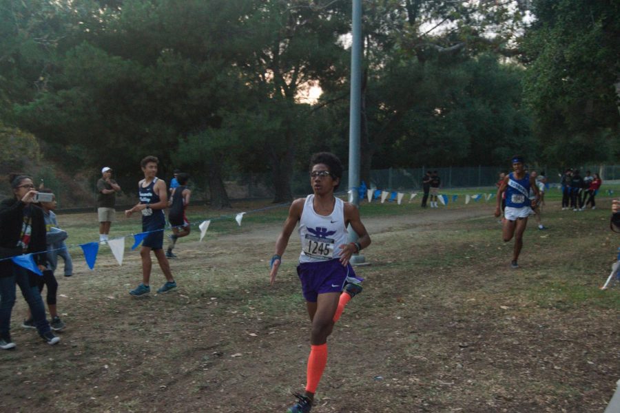 Freshman Parker Simmons runs near the finish line at a race in Crescenta Valley Park.
