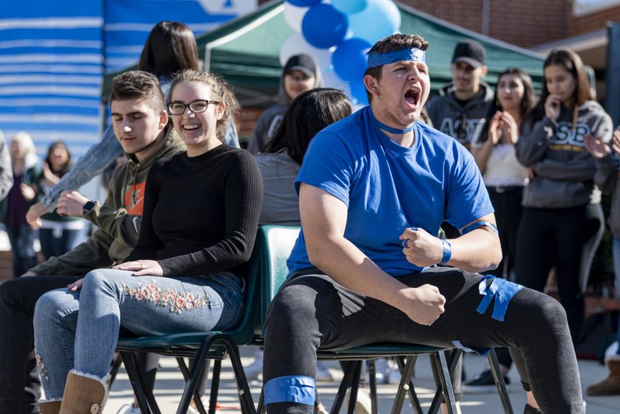  Students play musical chairs at the rally. The games were received with enthusiasm by many students.