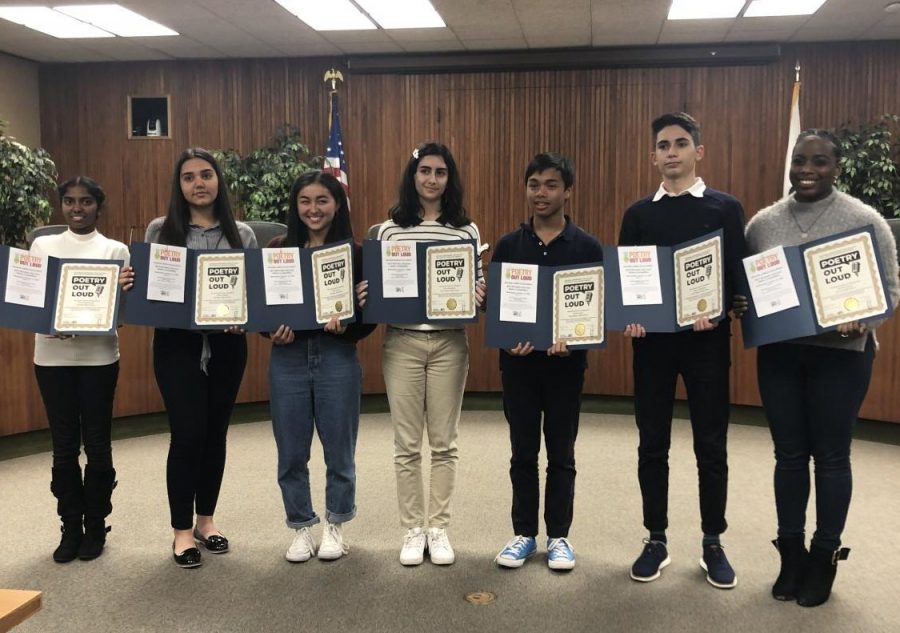 Clark students and students from all over the district pose with their event certificates.