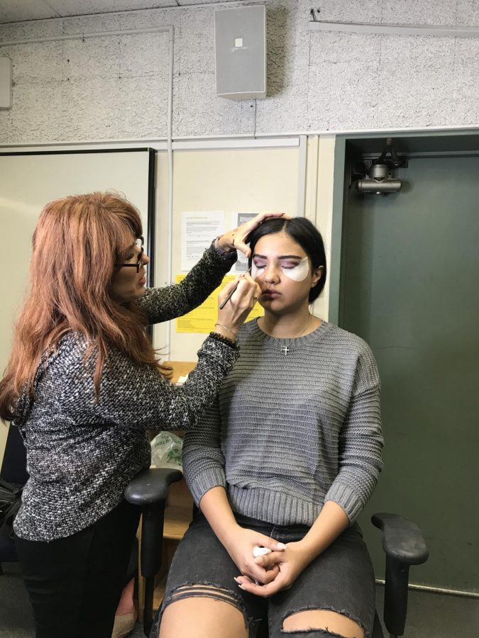 Instructor and makeup artist Michele Godinez demonstrates a natural-look on her model, Tatev.