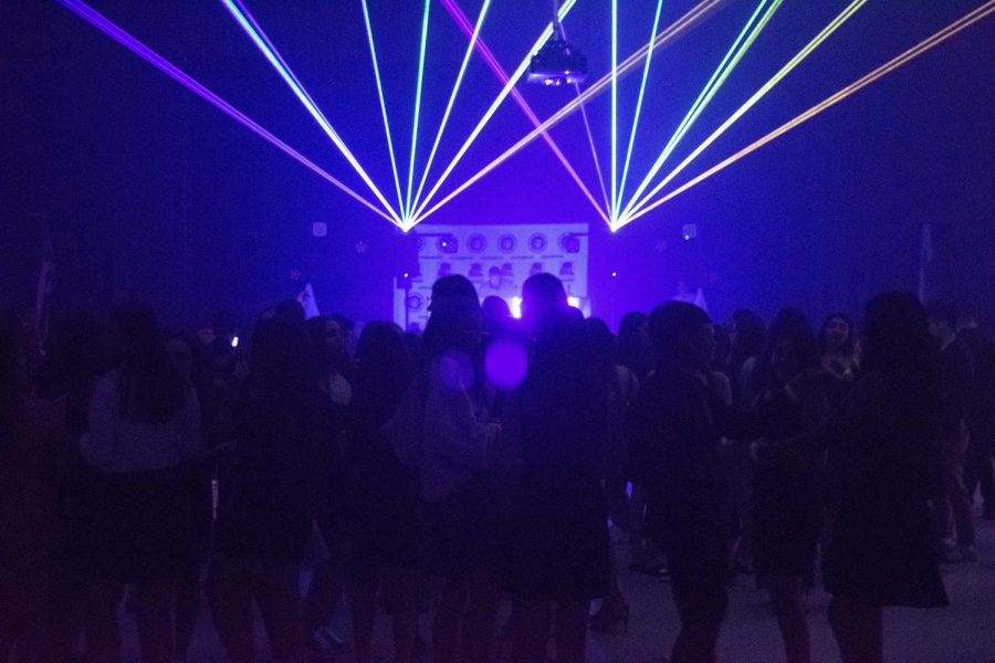 Strobe+lights+filled+the+auditorium+as+students+danced+to+the+music.