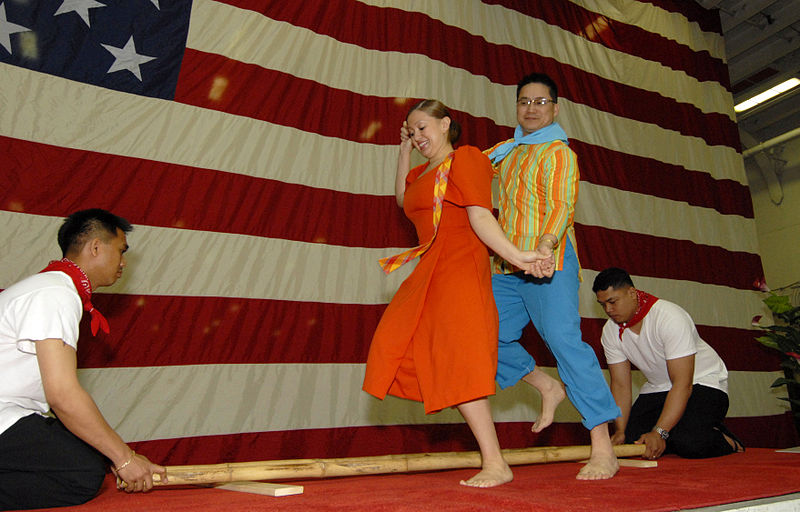 Two culinary specialists perform the Tinikling in honor of Asian-American Pacific Islander Heritage. The Tinikling folk dance originated in Palo, Layte.