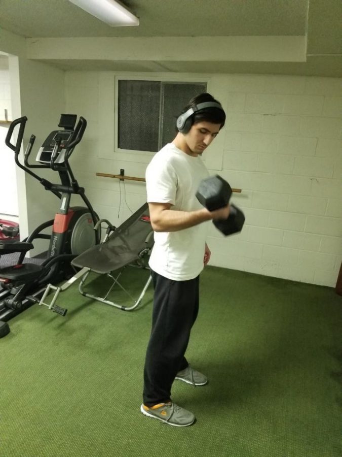 David Akskalyan works out in his at home gym. 