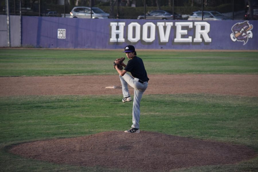 Ethan Tobey winds up to pitch for his team in a game last fall season. His sport was cut short because of lockdown in spring, and even with practice resuming soon, it will be even longer before proper games are played on the field again.