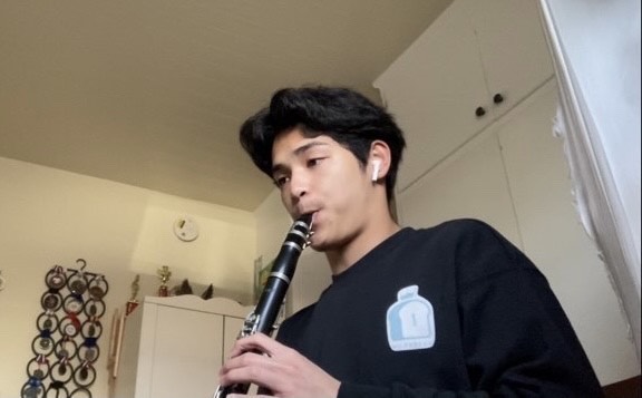 Clark senior Andre Hiwatig practices playing the clarinet, the instrument that began his music journey.