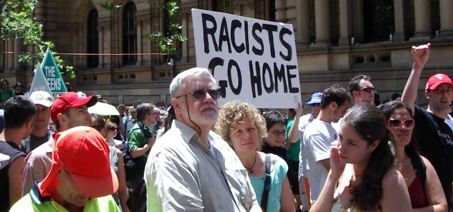 Anti-racism protesters in Sydney, Australia demand for people to change their opinions and end their xenophobia.