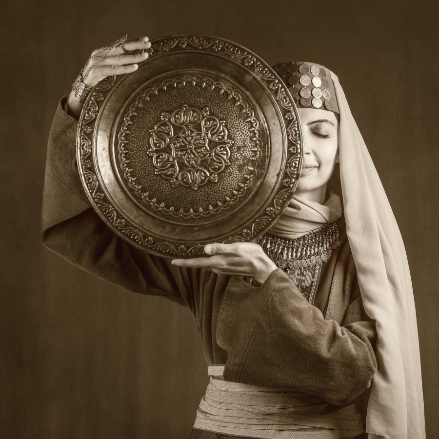 Armenian teacher Nina Minasyan dressed in a traditional Armenian garb, also known as a taraz.