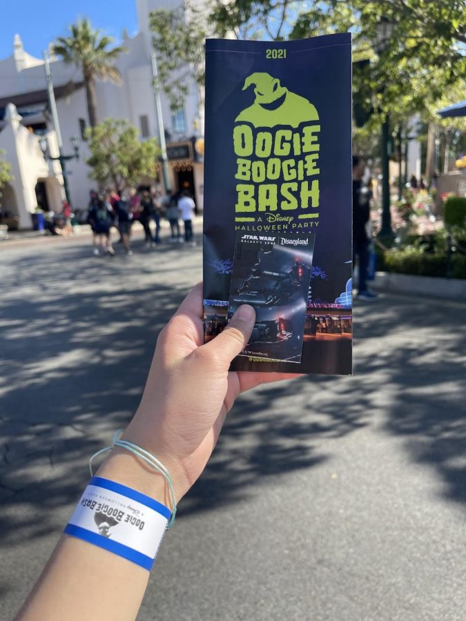 The photo of Alexa Sophia Camanag, showing her wristband and map to the exclusive and selective event, the Oogie Boogie Bash.
