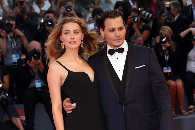 Johnny Depp and Amber Heard at the Venice International Film Festival for Depp's film premiere 
