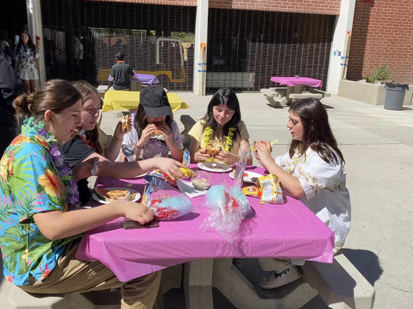 Seniors Nyra Tatoulian, Natalie Antonopoulos, Mary Zohrabyran, Nareh Agekian, and Claire Choi are enjoying the eventful BBQ as they eat their yummy burgers and delicious cotton candy. 
