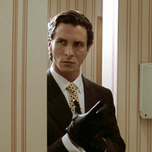Christian Bale posing as the iconic Patrick Bateman in a scene from the movie.