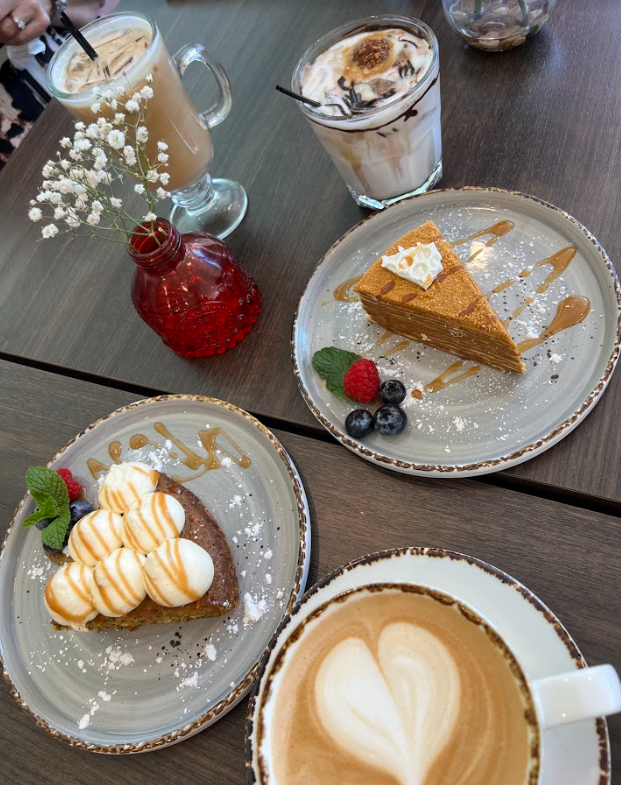  A variety of lattes and deserts that are available at My Café. 
