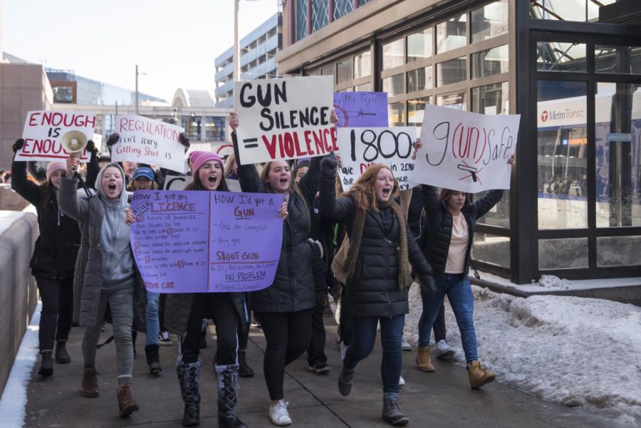 High School students gather to protest gun violence and demand change.