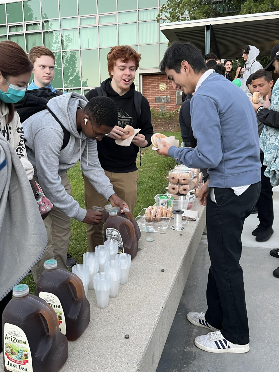 Seniors Isaac Sandler, Thomas Deane, and Daniel Sisay enjoying donuts and Arizona iced tea that were provided by ASB. 