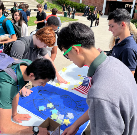 ASB Members Nicholas Fang and Alex Barfyan (on the right) facilitate the mock election for participants Isaac Sandler, Daniel Sisay, and Thomas Deane (on the left). 