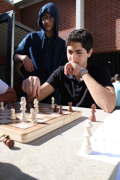 Sophomores Shawheen Balouch and Alexander Avenesyan engaged in a game of chess, as Belouch contemplates his next move. 