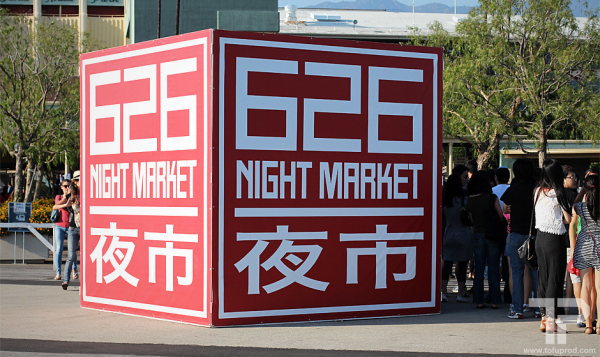 People gathering around the opening of the 626 Night Market, getting ready to take out their entry tickets.
